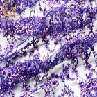 Сверкная пурпур яркого блеска вышил жемчугам ткани шнурка роскошным для платья вечера
